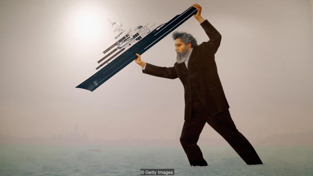 Jeremy Deller’s installation at the Venice biennale depicts William Morris throwing a superyacht into the lagoon