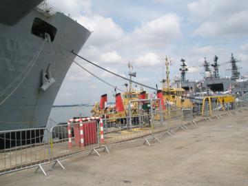 Two_tugs_sandwiched_between_HMS_Illustrious_and_the_Japanese_training_ships_-_geograph.org.uk_-_900486